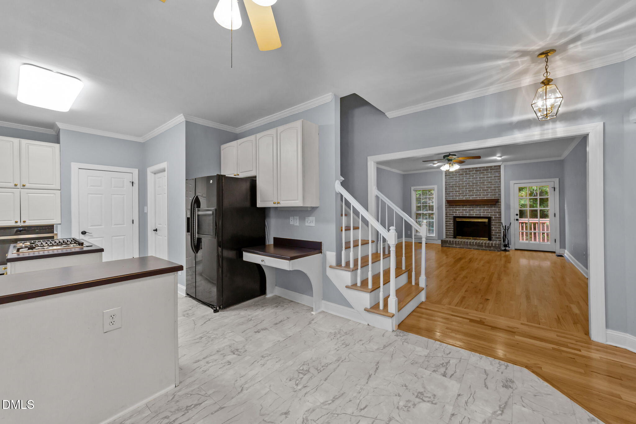 208 Adams Court Clayton, NC 27520 - Photo 6 of 63 a kitchen that has a lot of cabinets in it