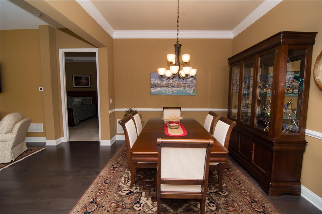 4097 Rutz Lane Allentown, PA 18104 - Photo 21 of 59 Rich hardwood floors and elegant crown molding define this formal dining space.