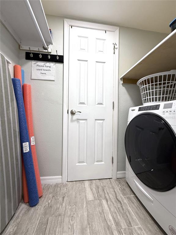 13711 Gulf Boulevard, Unit 1 Madeira Beach, FL 33708 - Photo 22 of 36 a view of a storage & utility room with washer and dryer