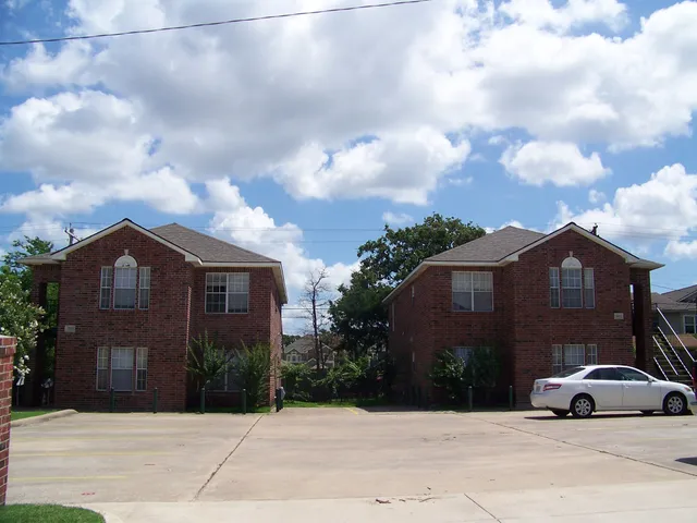 a view of a parked cars in front of house