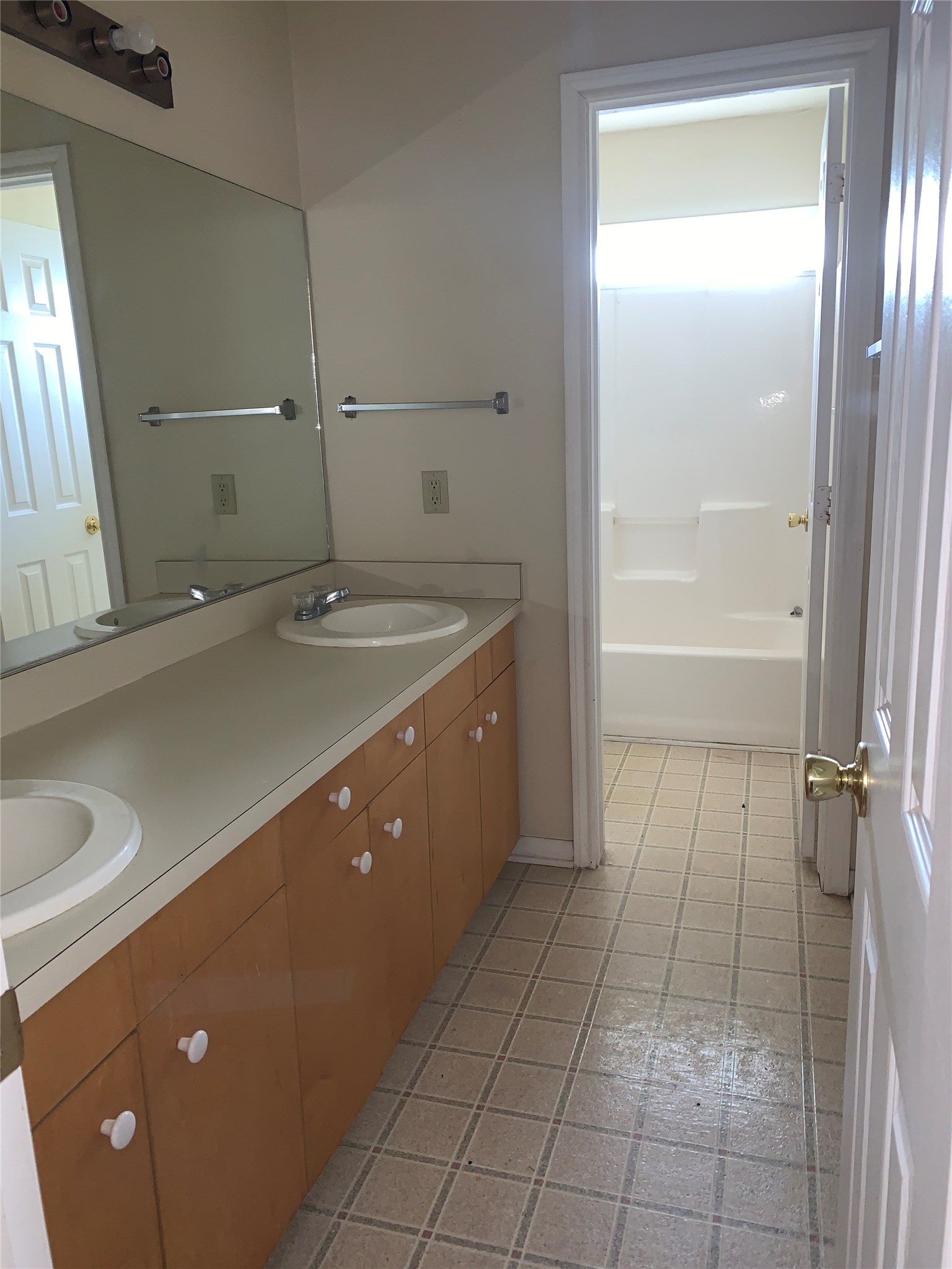 3901 College Main Street, Unit B Bryan, TX 77801 - Photo 16 of 25 a bathroom with a sink a toilet and shower
