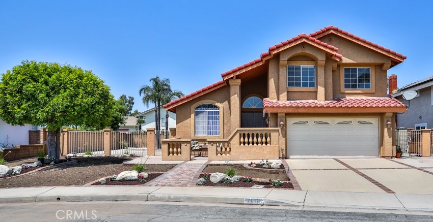 7076 Wheaton Court Rancho Cucamonga, CA 91701 - Photo 1 of 1 a front view of a house with a yard and garage