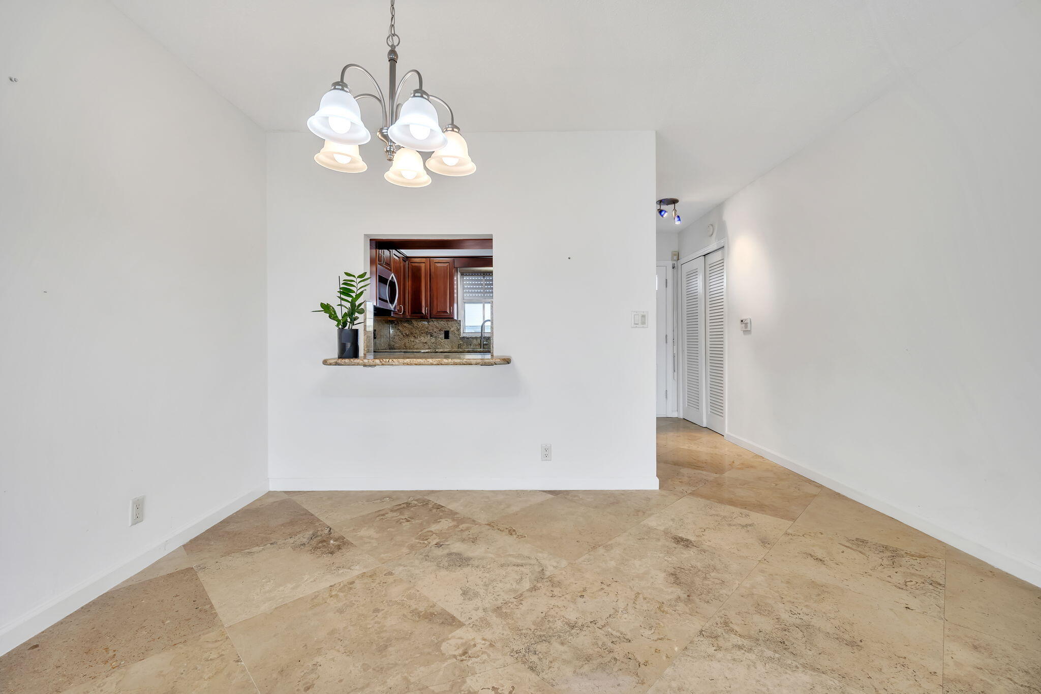 2400 Northeast 36th Street, Unit 7 Lighthouse Point, FL 33064 - Photo 14 of 27 en empty room with wooden floor and window