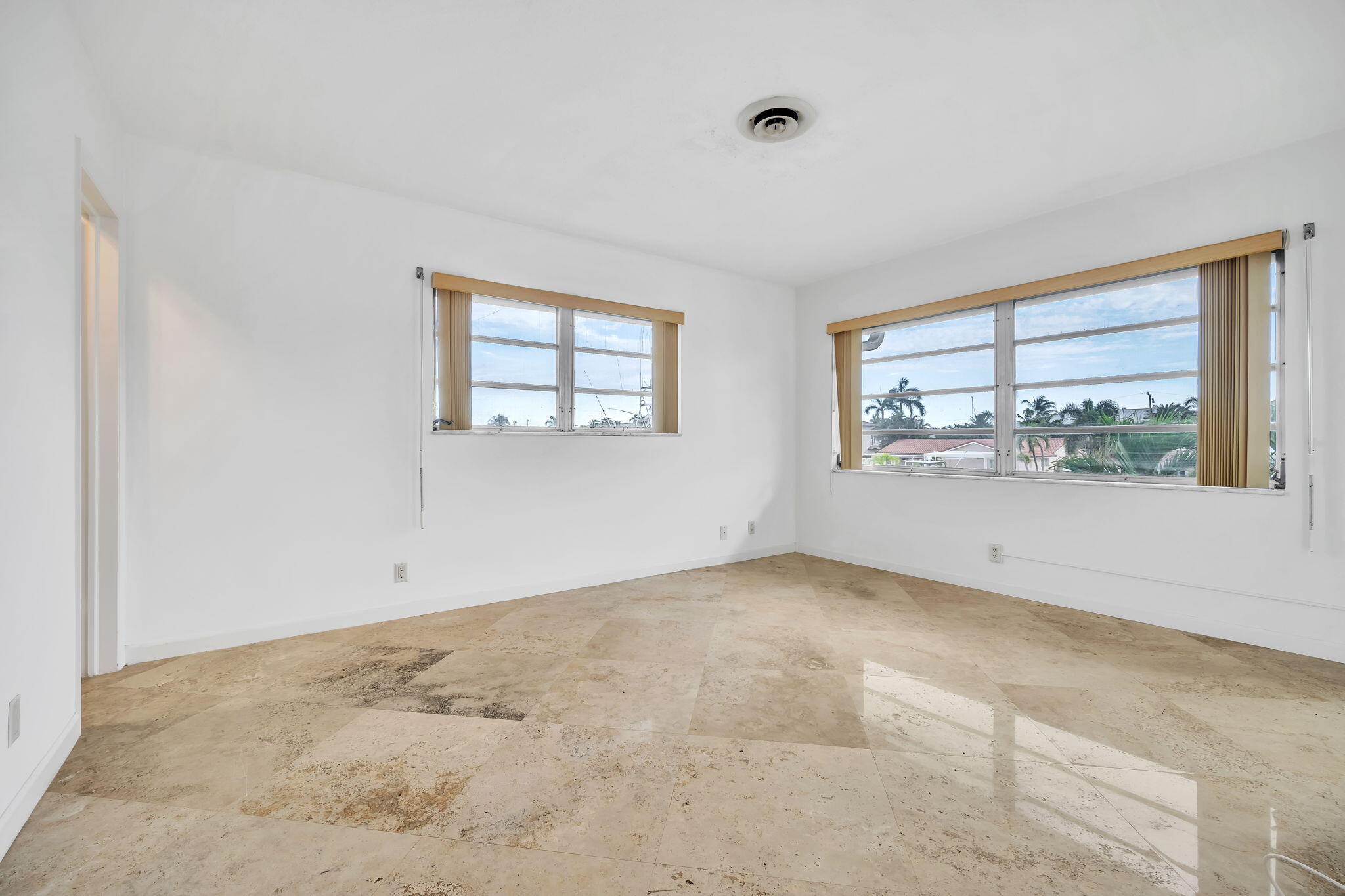 2400 Northeast 36th Street, Unit 7 Lighthouse Point, FL 33064 - Photo 15 of 27 an empty room with windows