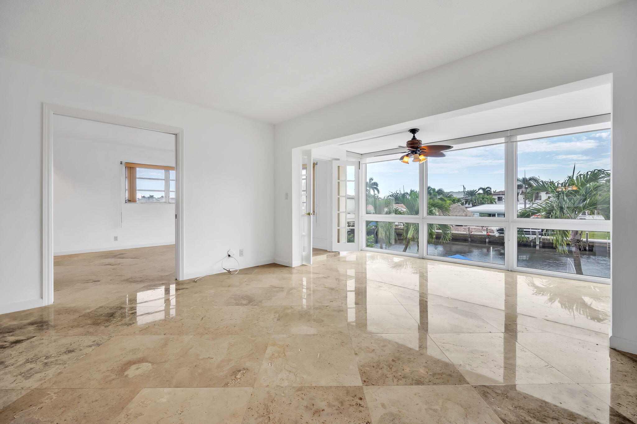 2400 Northeast 36th Street, Unit 7 Lighthouse Point, FL 33064 - Photo 2 of 27 an empty room with windows