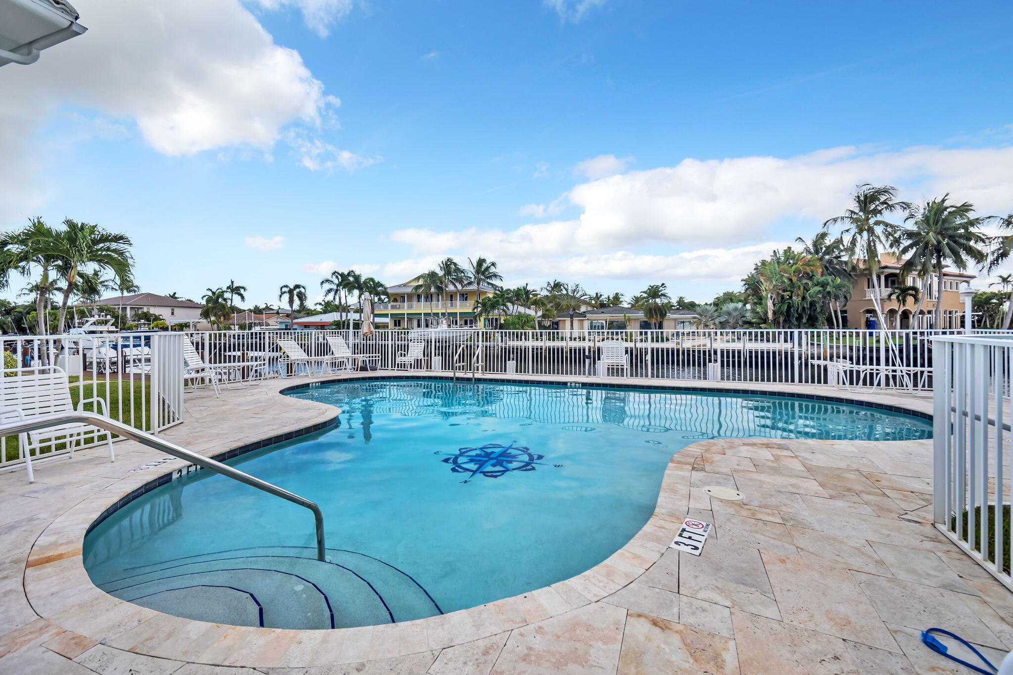 2400 Northeast 36th Street, Unit 7 Lighthouse Point, FL 33064 - Photo 27 of 27 a view of a swimming pool with a chair