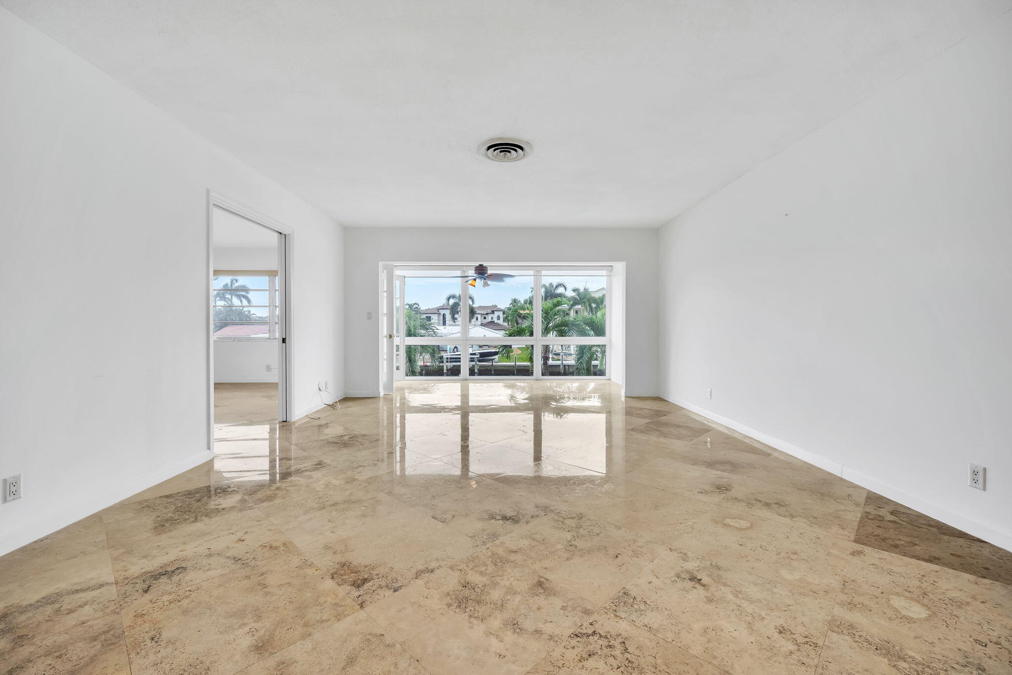 2400 Northeast 36th Street, Unit 7 Lighthouse Point, FL 33064 - Photo 4 of 27 an empty room with windows