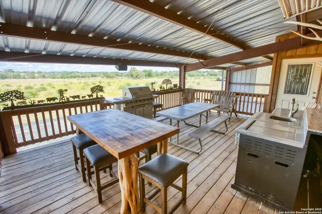 a room with table chairs and wooden floor