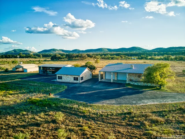 a view of a lake with houses in the back