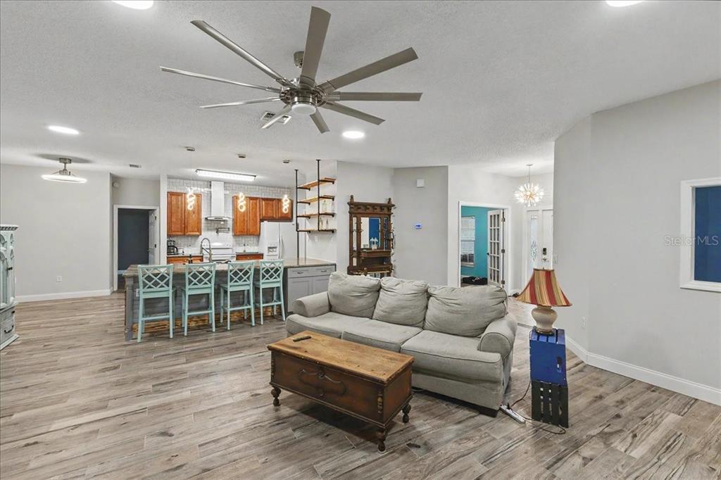 1830 Orange Tree Drive Edgewater, FL 32132 - Photo 11 of 23 a living room with furniture and a wooden floor