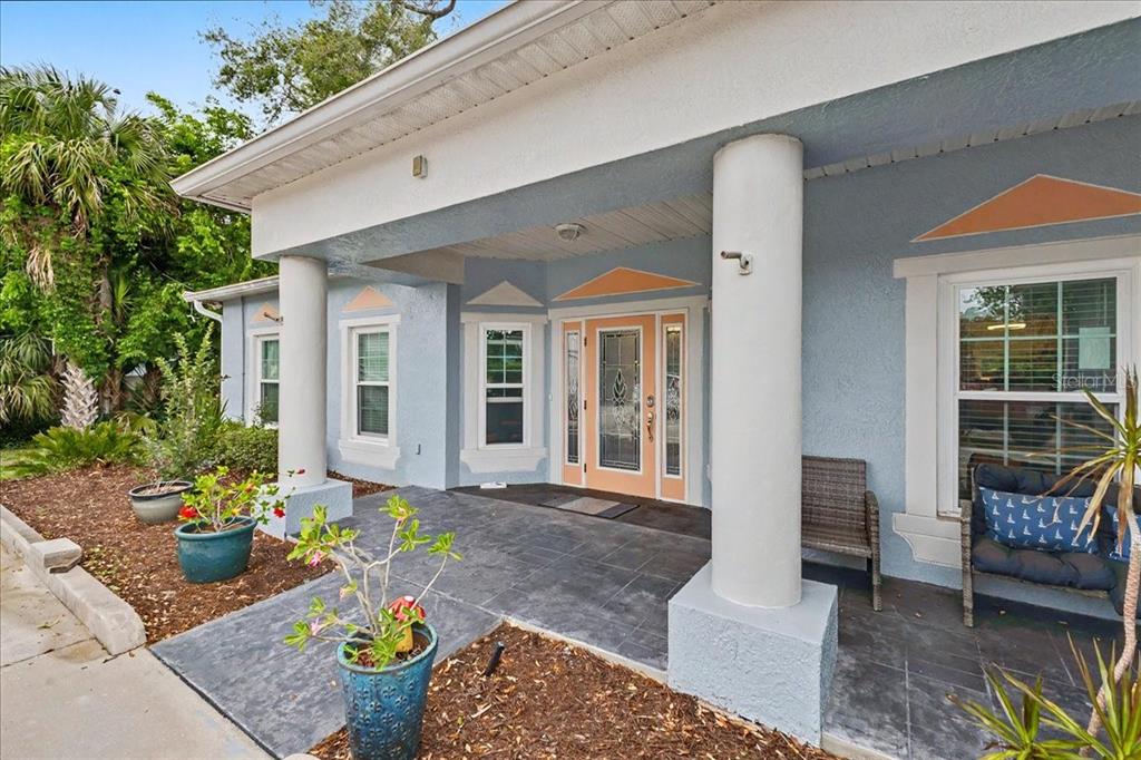 1830 Orange Tree Drive Edgewater, FL 32132 - Photo 2 of 23 a front view of a house with outdoor seating