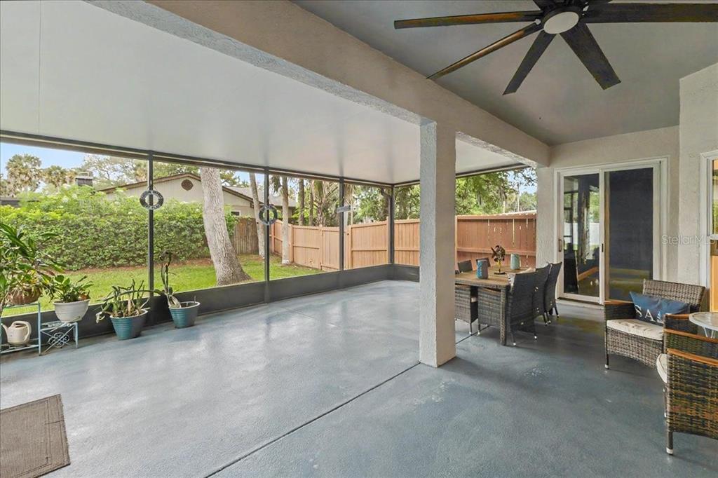 1830 Orange Tree Drive Edgewater, FL 32132 - Photo 21 of 23 a view of an empty room with large windows