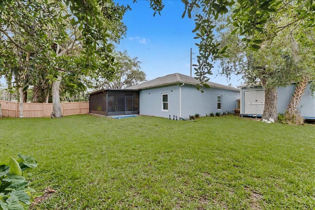 1830 Orange Tree Drive Edgewater, FL 32132 - Photo 23 of 23 a view of a backyard with a garden