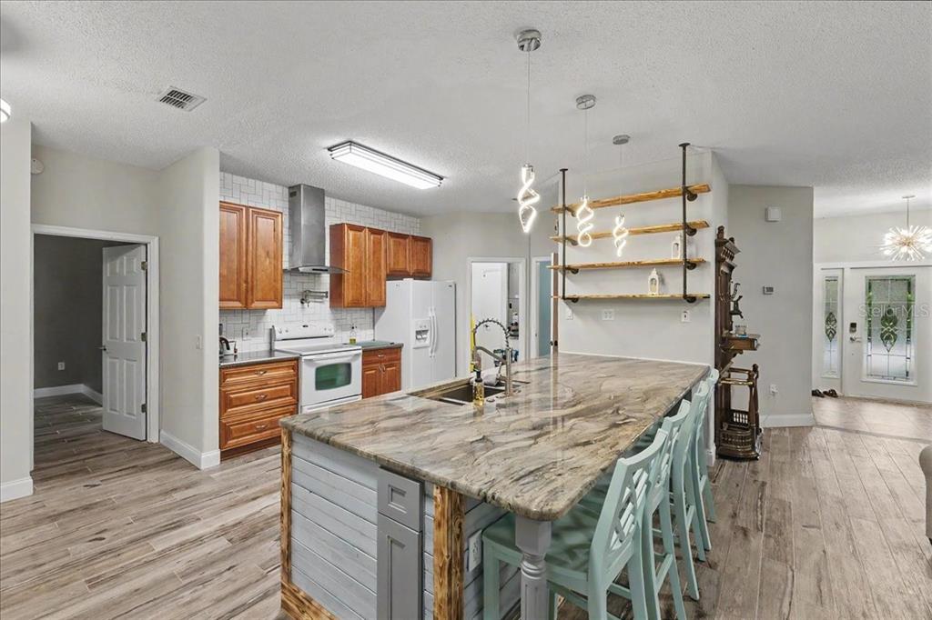 1830 Orange Tree Drive Edgewater, FL 32132 - Photo 6 of 23 a kitchen with a table and chairs in it