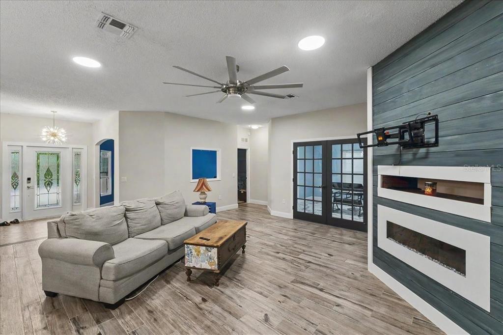 1830 Orange Tree Drive Edgewater, FL 32132 - Photo 10 of 23 a living room with furniture and wooden floor