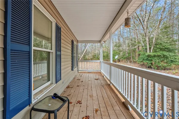 a view of outdoor space with deck and tree