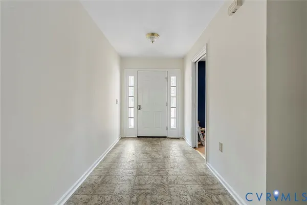 a view of a hallway with a room