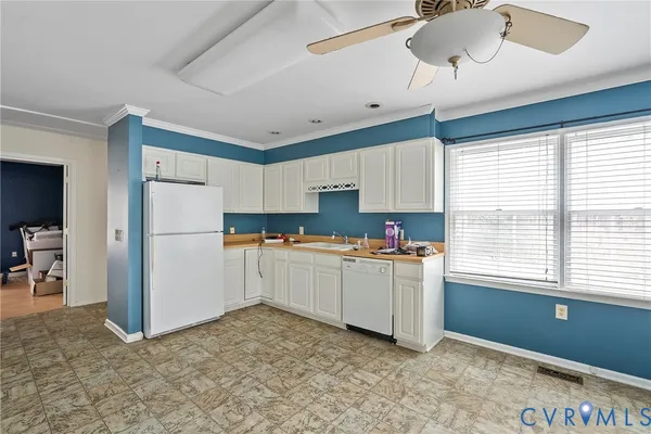 a kitchen with refrigerator and window