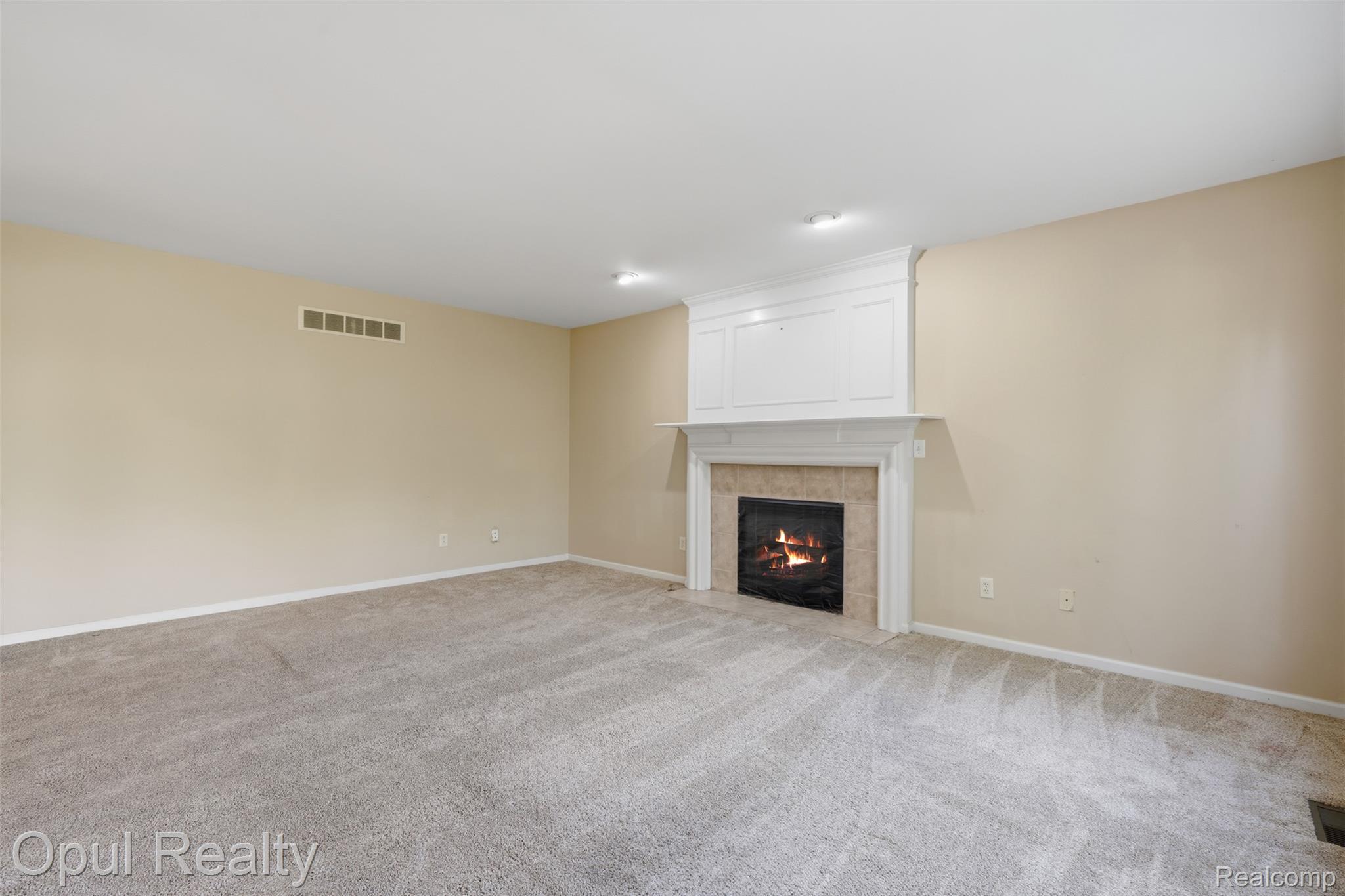4530 Pond Run Canton, MI 48188 - Photo 13 of 43 Carpeted room featuring a white fireplace mantel with panel detailing