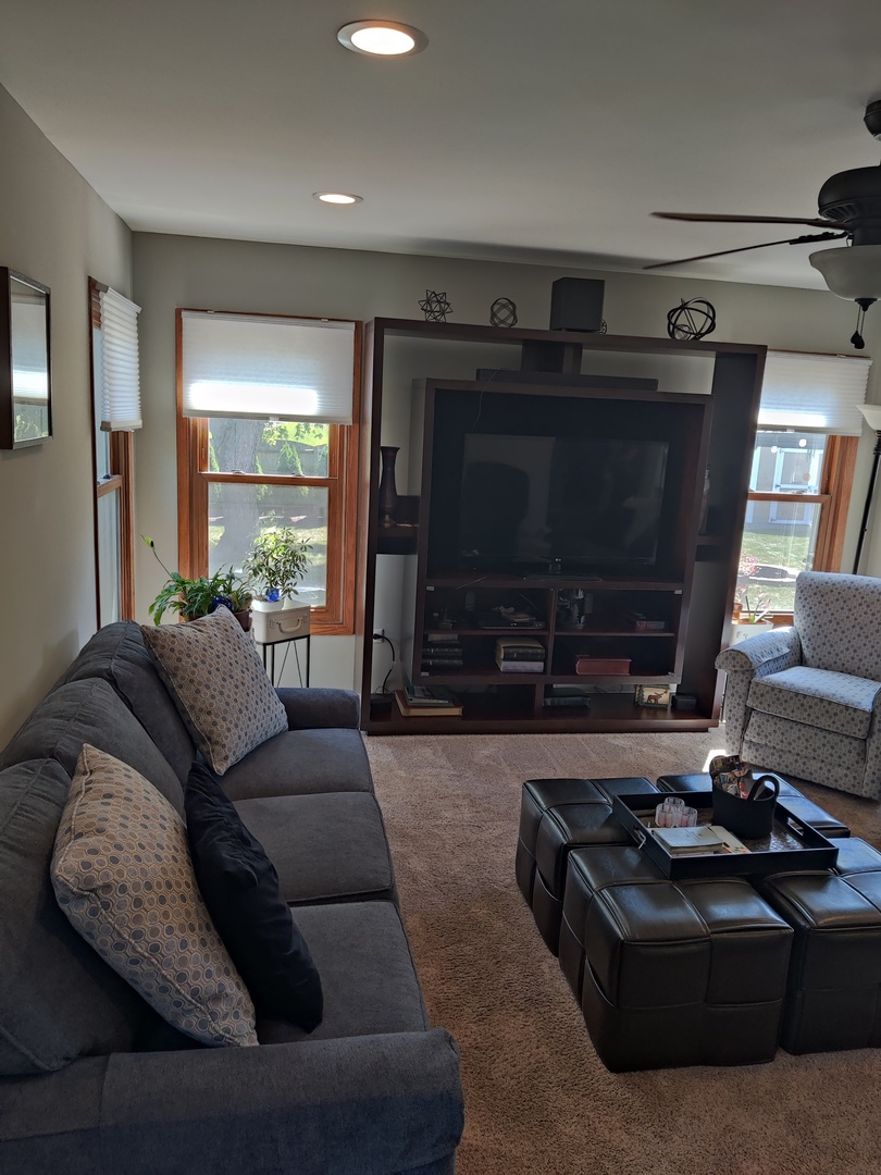 1681 Boulder Ridge Drive Bolingbrook, IL 60490 - Photo 11 of 17 a living room with furniture and a flat screen tv