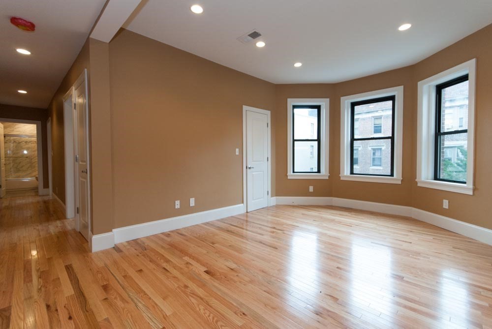 6 Lothian Road, Unit 3 Boston, MA 02135 - Photo 9 of 10 a view of empty room with wooden floor and fan
