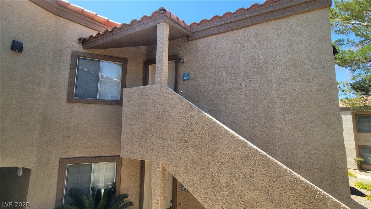 1851 Hillpointe Road, Unit 1022 Henderson, NV 89074 - Photo 8 of 8 A well-maintained stucco exterior features a tile roof and convenient upper-level entry.