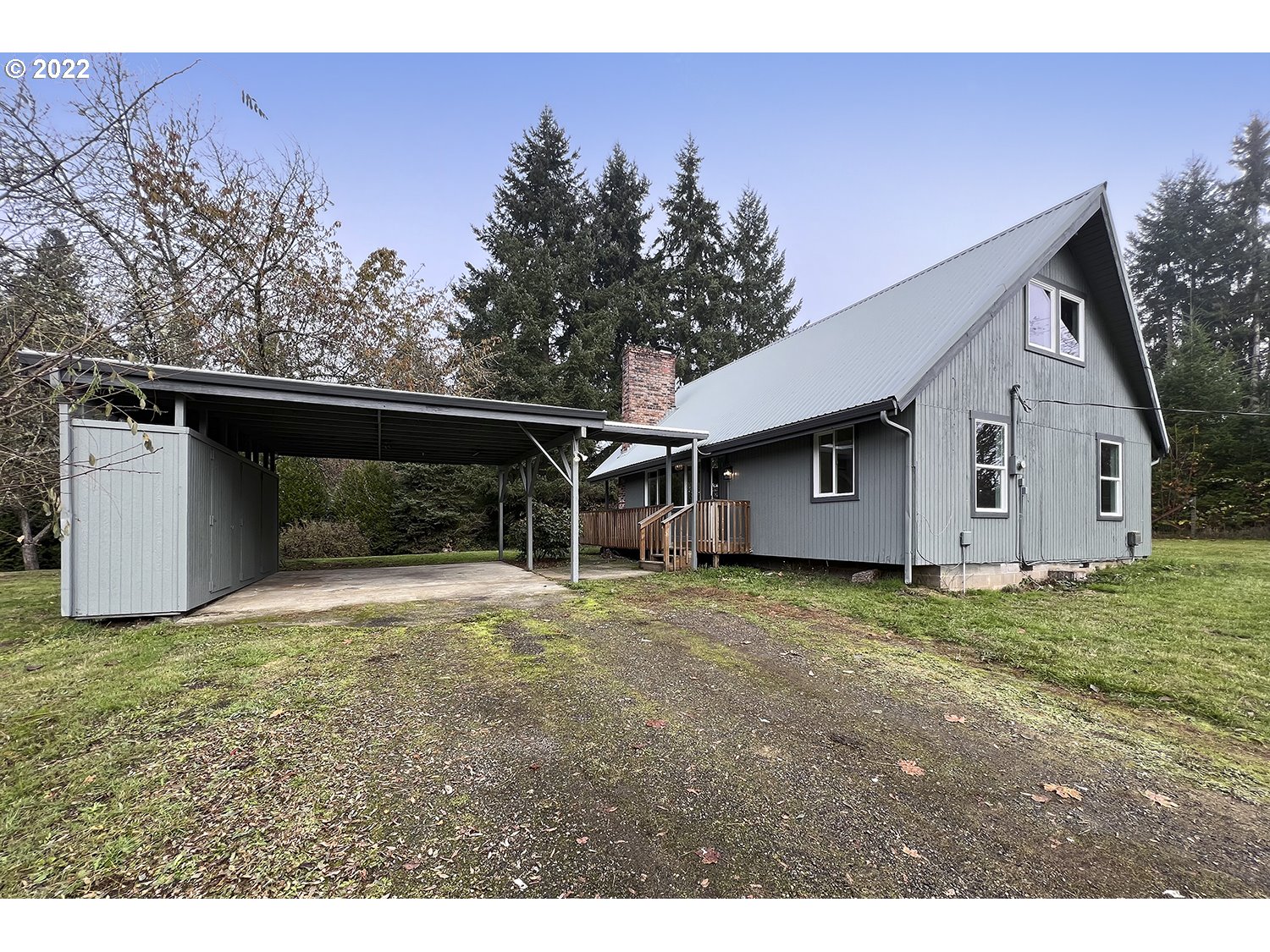 23706 Northeast 10th Avenue Ridgefield, WA 98642 - Photo 1 of 32 a view of backyard with wooden fence and large trees
