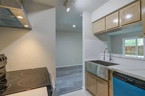 a kitchen with a sink and cabinets
