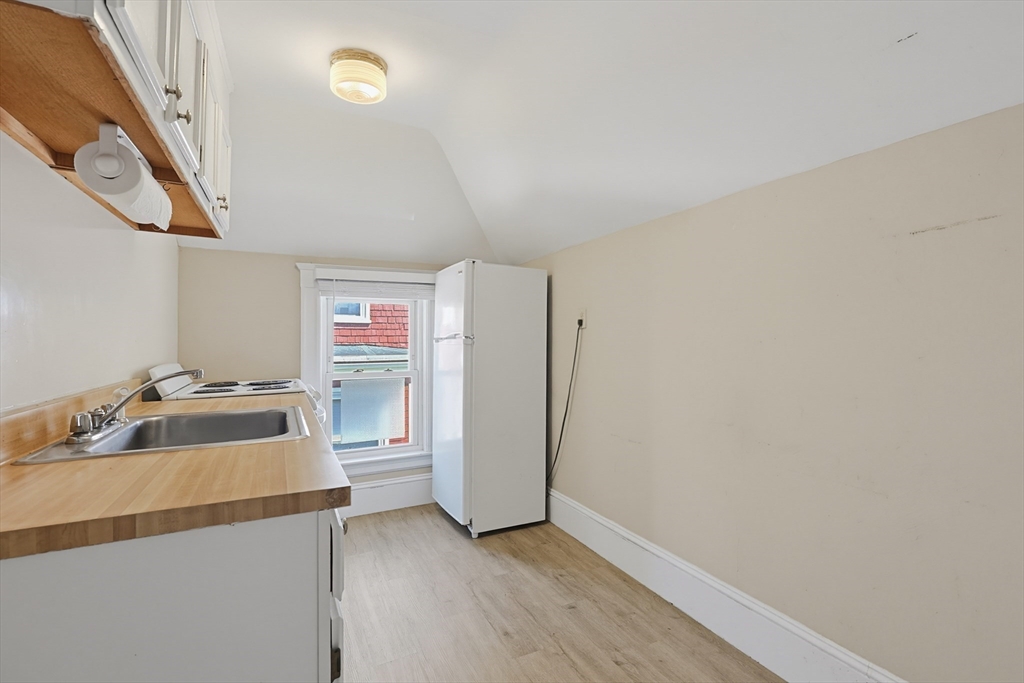 157 Elm Street Somerville, MA 02144 - Photo 15 of 19 a room with storage and utility