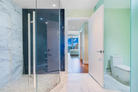a view of a bathroom from a hallway