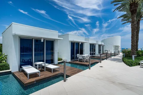 a view of a house with patio and sitting area