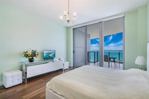 a bedroom with bed and a window