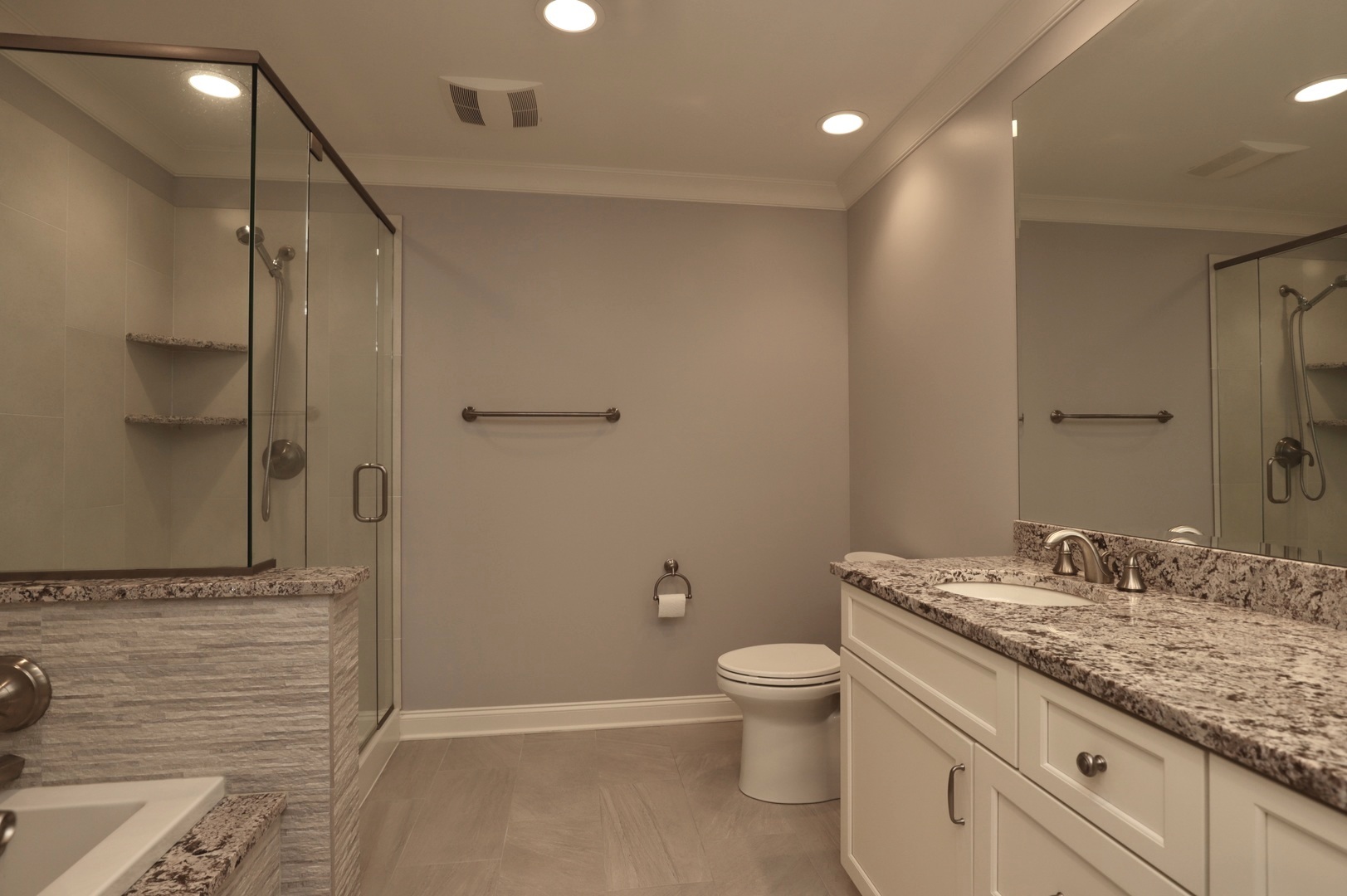 1802 Camden Drive Glenview, IL 60025 - Photo 13 of 21 a bathroom with a granite countertop sink a toilet and shower