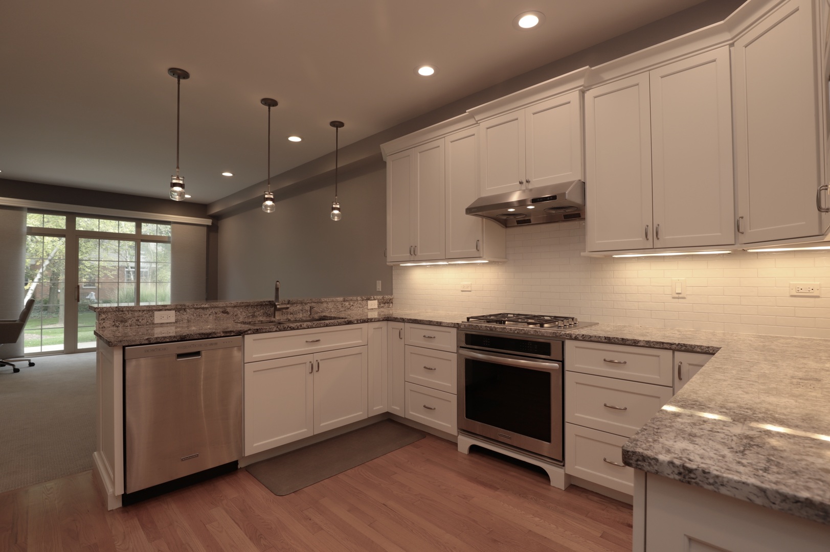 1802 Camden Drive Glenview, IL 60025 - Photo 7 of 21 a kitchen with stainless steel appliances granite countertop a stove a sink and a refrigerator