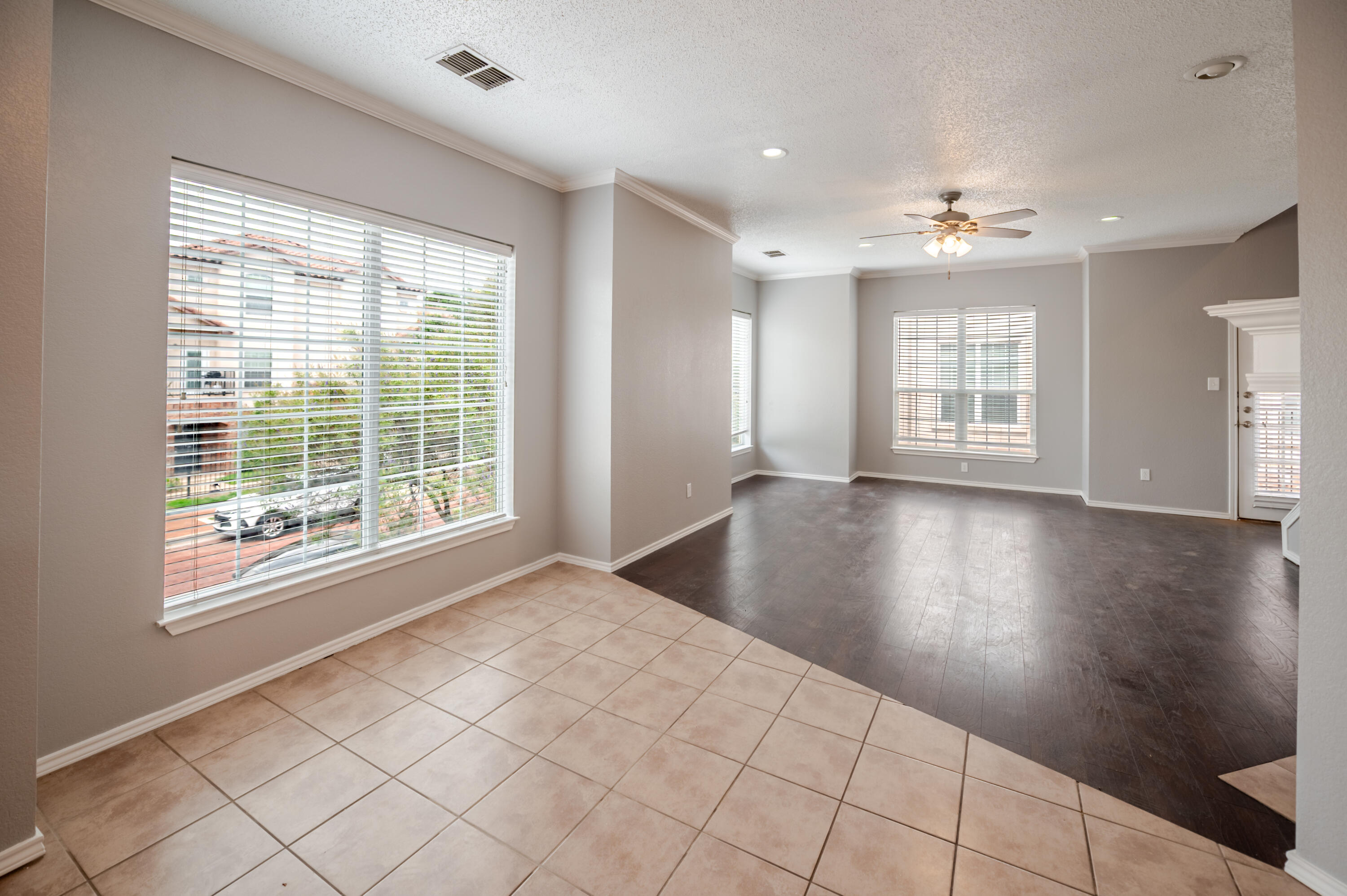 2111 Main Street, Unit 1 Lubbock, TX 79401 - Photo 7 of 36 a view of an empty room with wooden floor and a window