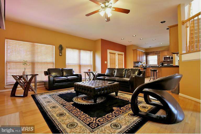 6189 Deer Ridge Trail Springfield, VA 22150 - Photo 3 of 30 a living room with furniture and a floor to ceiling window
