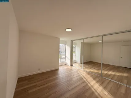 a bathroom with a sink a toilet a mirror and shower