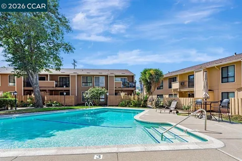 a balcony with trees in front of it