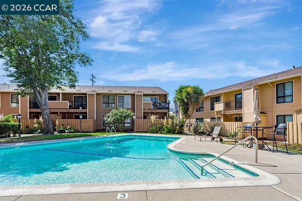 a balcony with trees in front of it