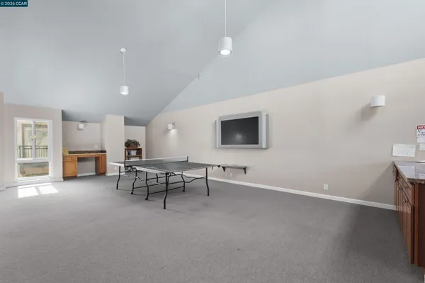 a view of a house with backyard and trees