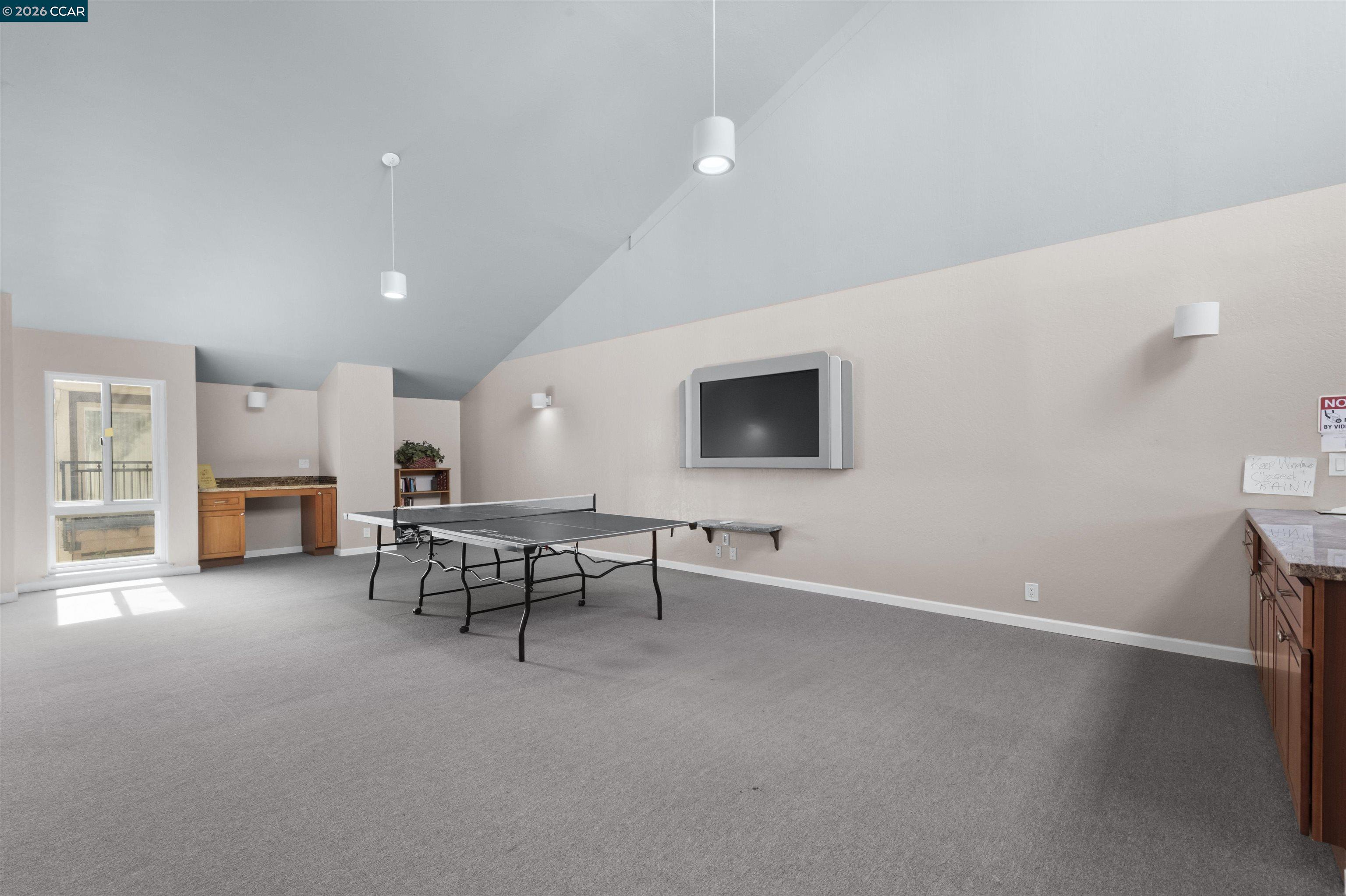 8975 Alcosta Boulevard, Unit 116 San Ramon, CA 94583 - Photo 25 of 30 a living room with furniture and a flat screen tv