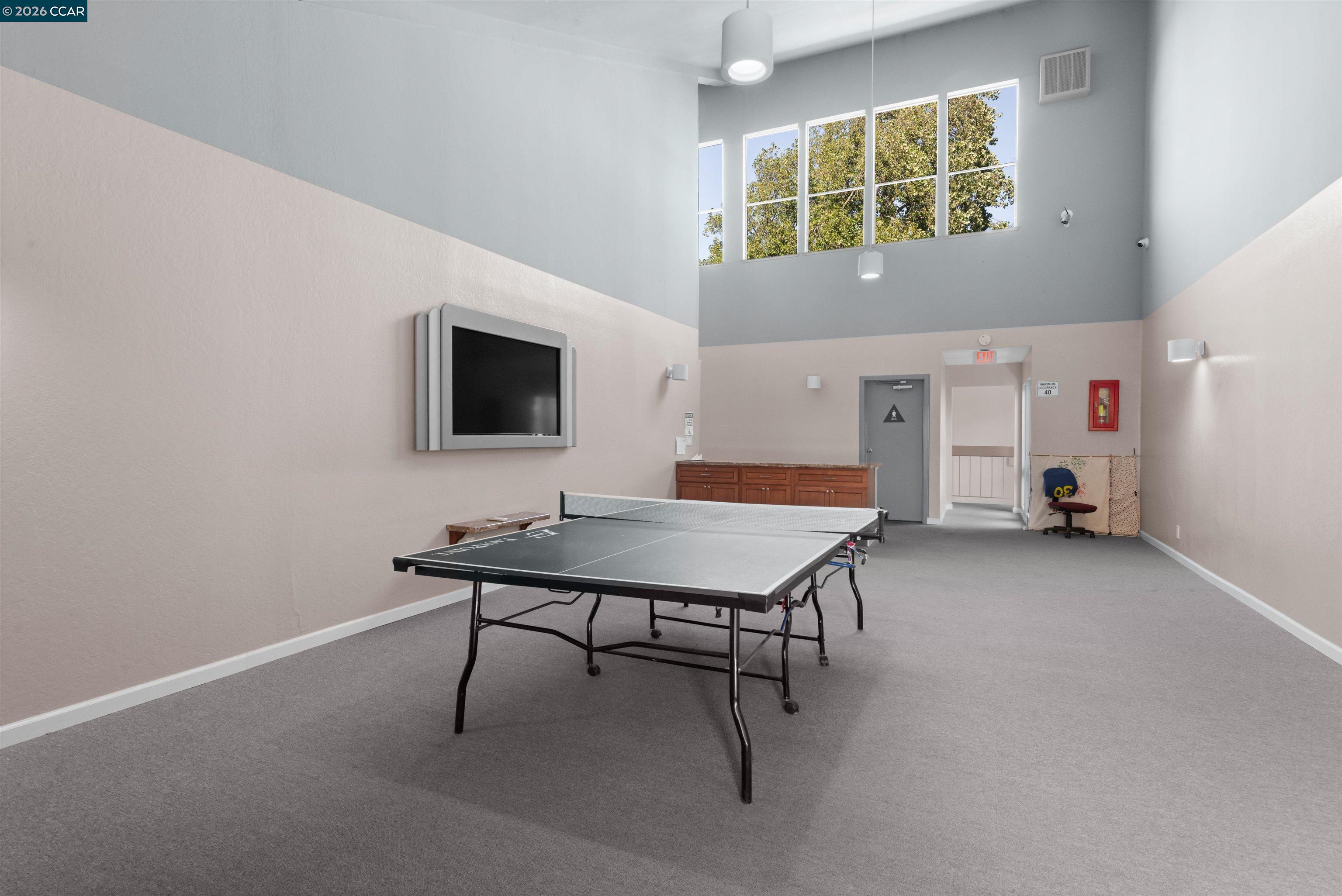 8975 Alcosta Boulevard, Unit 116 San Ramon, CA 94583 - Photo 26 of 30 a room with furniture and a flat screen tv