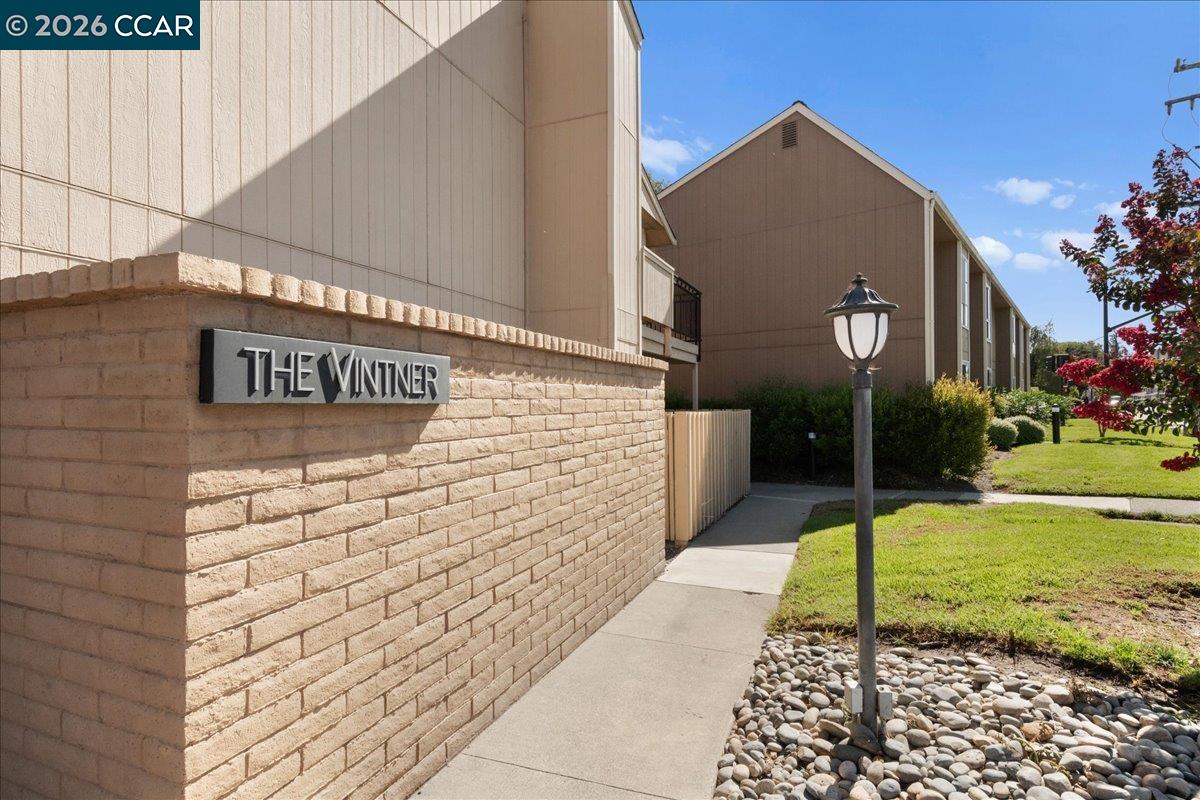 8975 Alcosta Boulevard, Unit 116 San Ramon, CA 94583 - Photo 29 of 30 a sign board on the side of a building