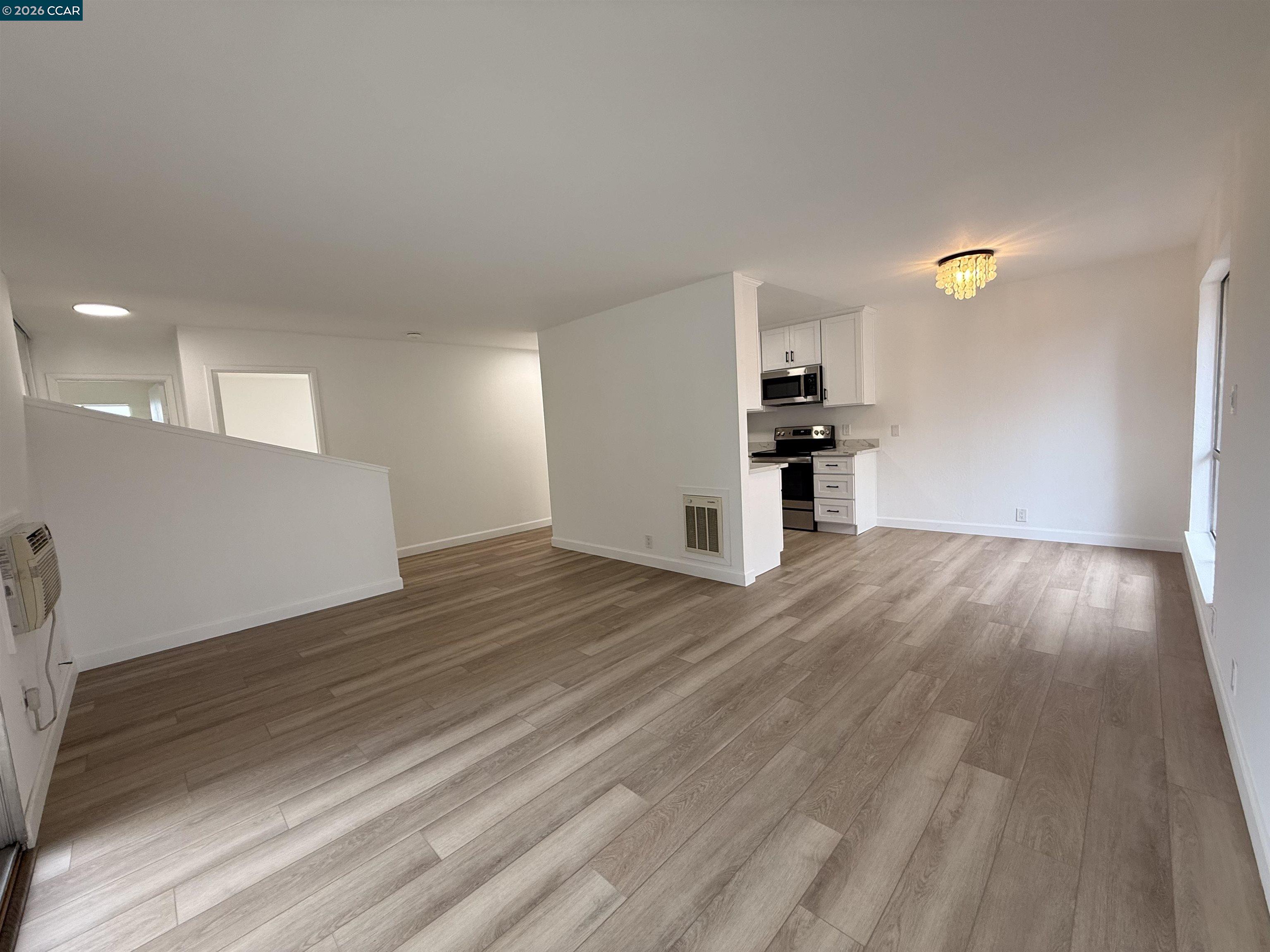 8975 Alcosta Boulevard, Unit 116 San Ramon, CA 94583 - Photo 9 of 30 a view of empty room with wooden floor