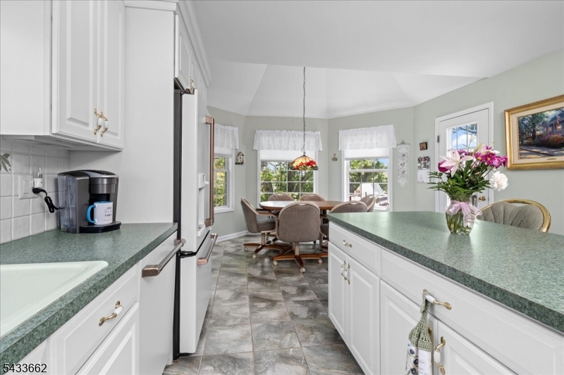 15 Bracken Hill Road Hamburg, NJ 07419 - Photo 17 of 44 a kitchen with sink cabinets and potted plant