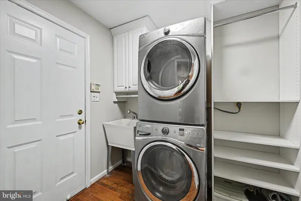 a view of a hallway with washer and dryer