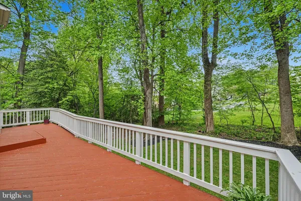 a balcony with trees in front of it