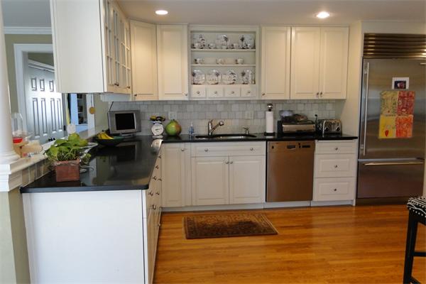 61 Audubon Road Wellesley, MA 02481 - Photo 3 of 12 a kitchen with stainless steel appliances granite countertop a stove a sink and a refrigerator
