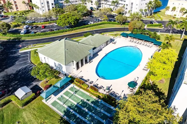 an aerial view of a house with a swimming pool yard and outdoor seating