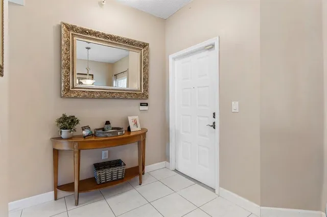 a room that has a dresser and a mirror in it